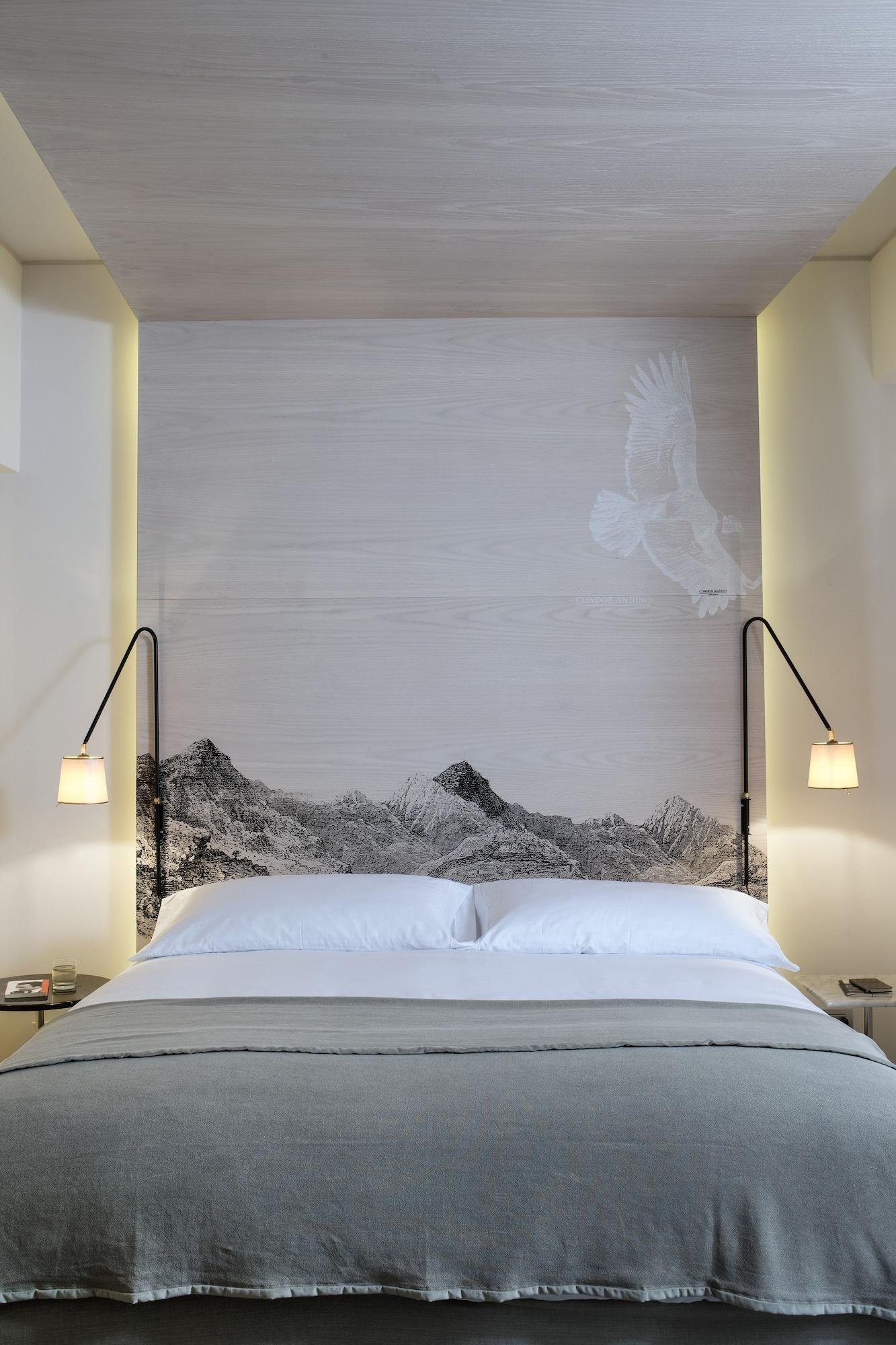 Hotel Magnolia Santiago Luaran gambar A bed with a headboard